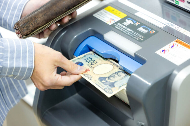 Paying with cash at a convenience store terminal